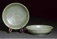 Qianlong six character marks and of the period A pair of spinach jade dishes